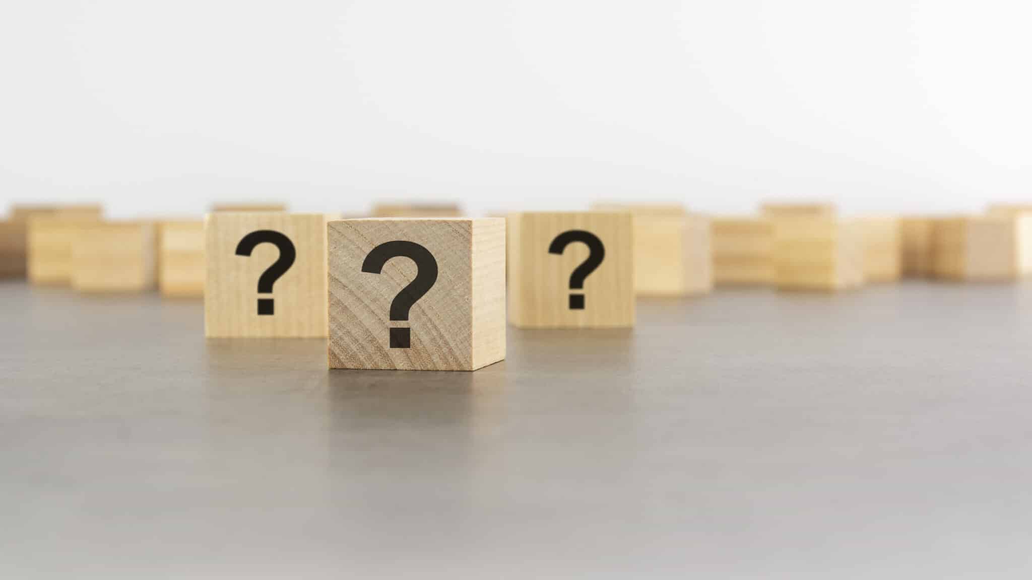 Cube with question mark on wooden background, Evaporative Cooler.