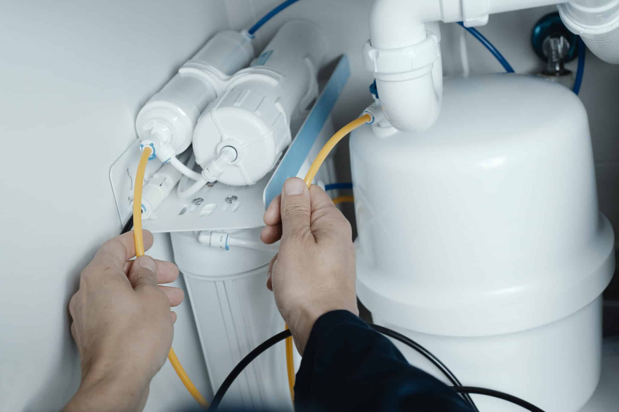 Installing water filtration system.