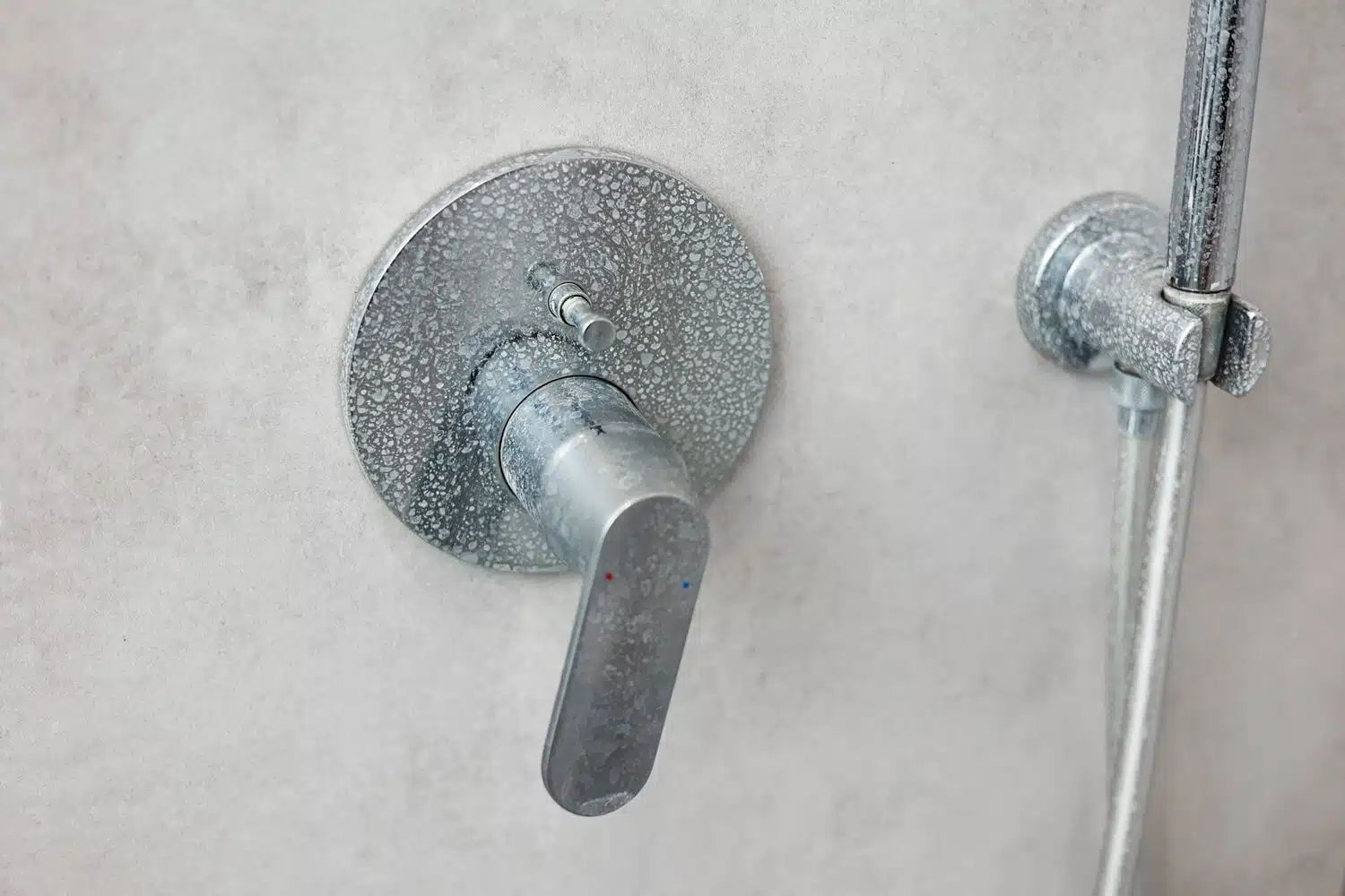 limescale buildup and white deposits due to hard water