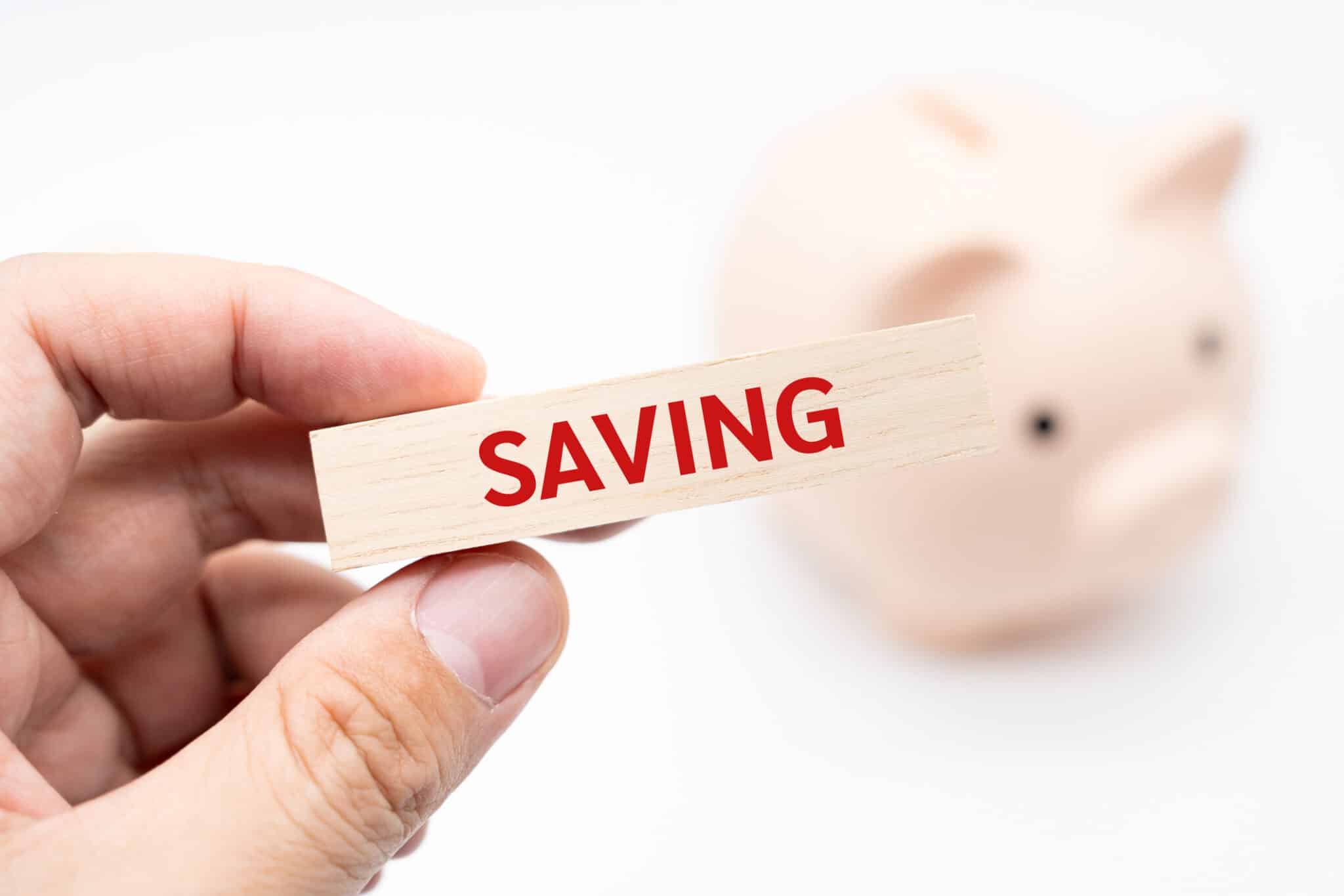 Text SAVING on wooden block, Seasonal Plumbing Maintenance Checks.