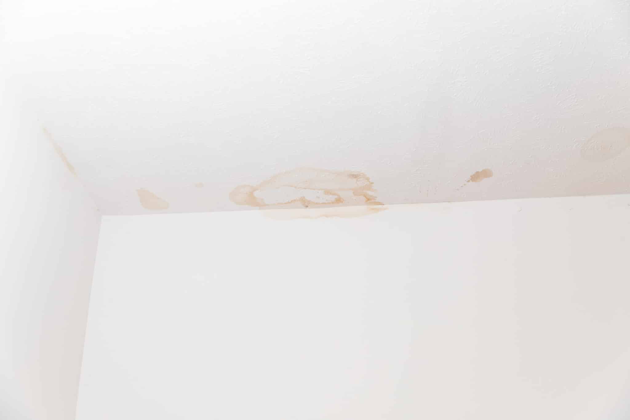 Ceiling stained from water damage, Pipe Damage From Humidity.
